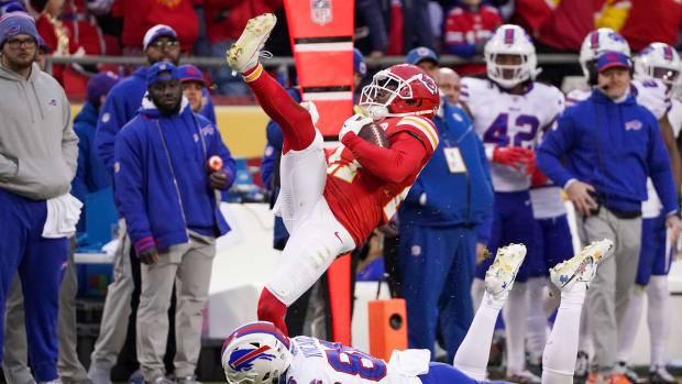 Dec 10, 2023; Kansas City, Missouri, USA; Kansas City Chiefs safety Chamarri Conner (27) intercepts a pass intended for Buffalo Bills tight end Dalton Kincaid (86) during the first half at GEHA Field at Arrowhead Stadium. Mandatory Credit: Denny Medley-USA TODAY Sports  
